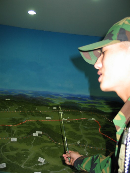 A South Korean soldier in front of the DMZ model